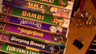 A stretch discussing how VHS changed Disney's animation practices uses this new film showing off a hypothetical family's collection of clamshell videocassettes.